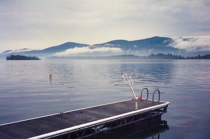 Lake George dock shot on Cinestill 800T with a Rollei XF-35, developed at Old School Photo Lab, by Lucy Mueller