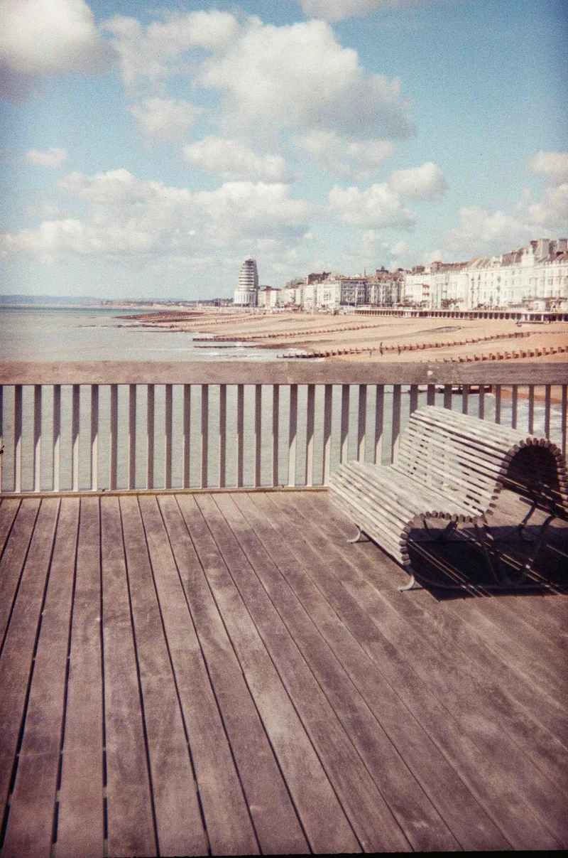 Marine Court, as seen from Hastings Pier shot on Lomography CN 400 with a Holga 135, developed at Take It Easy, by Jon