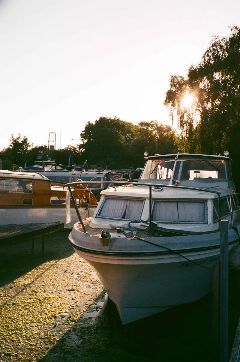 Golden hour boat yard shot on Fujifilm 200 with a Leica C1, developed at The Film Safe, by JFR Film