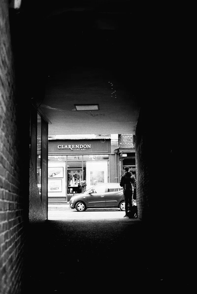 Charity man shot on Ilford FP4 Plus 125 with a Canon AV-1, developed at Film Processing, by Ols