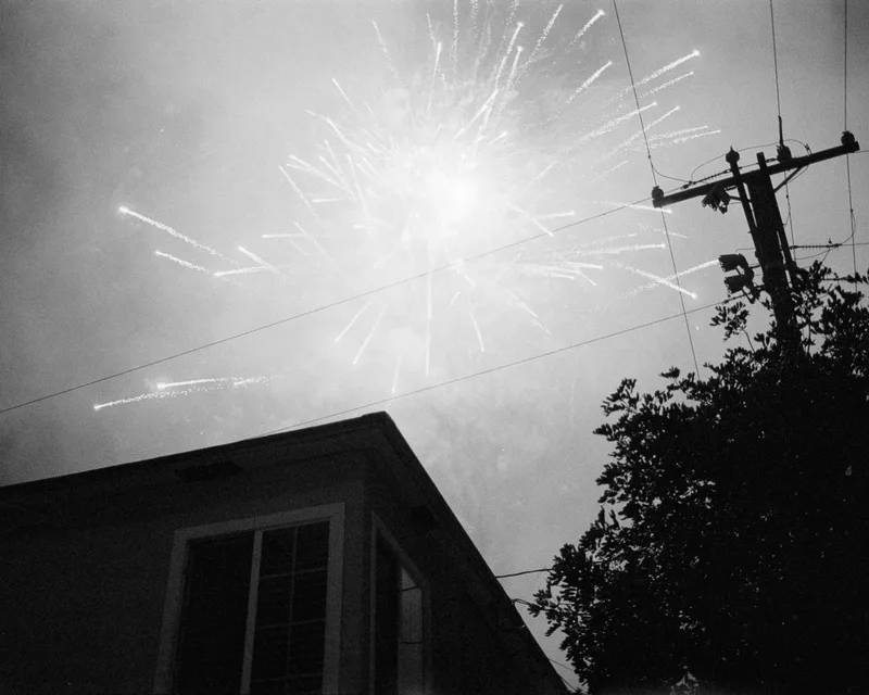 Fireworks in a neighborhood shot on Ilford HP5 Plus 400 with a Canon EOS Elan 7, developed at Home / Self-Developed, by Harper