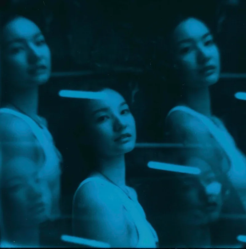 Kyoko in blue shot on Polaroid Duochrome Blue with a Polaroid SX-70 Sonar, by aboxofpolaroids