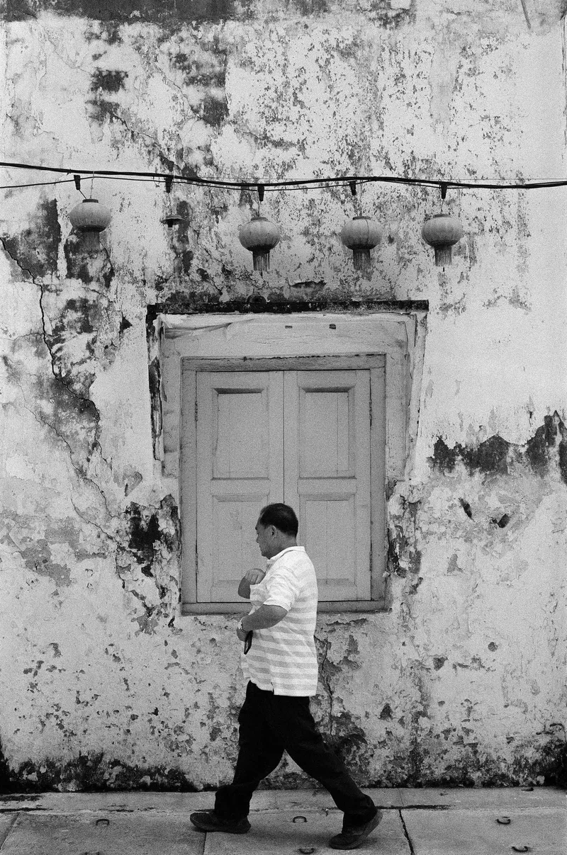 Walking into the frame shot on Delta 100 with a Canon AE1-P , developed at Filmpark Shanghai, by Kian