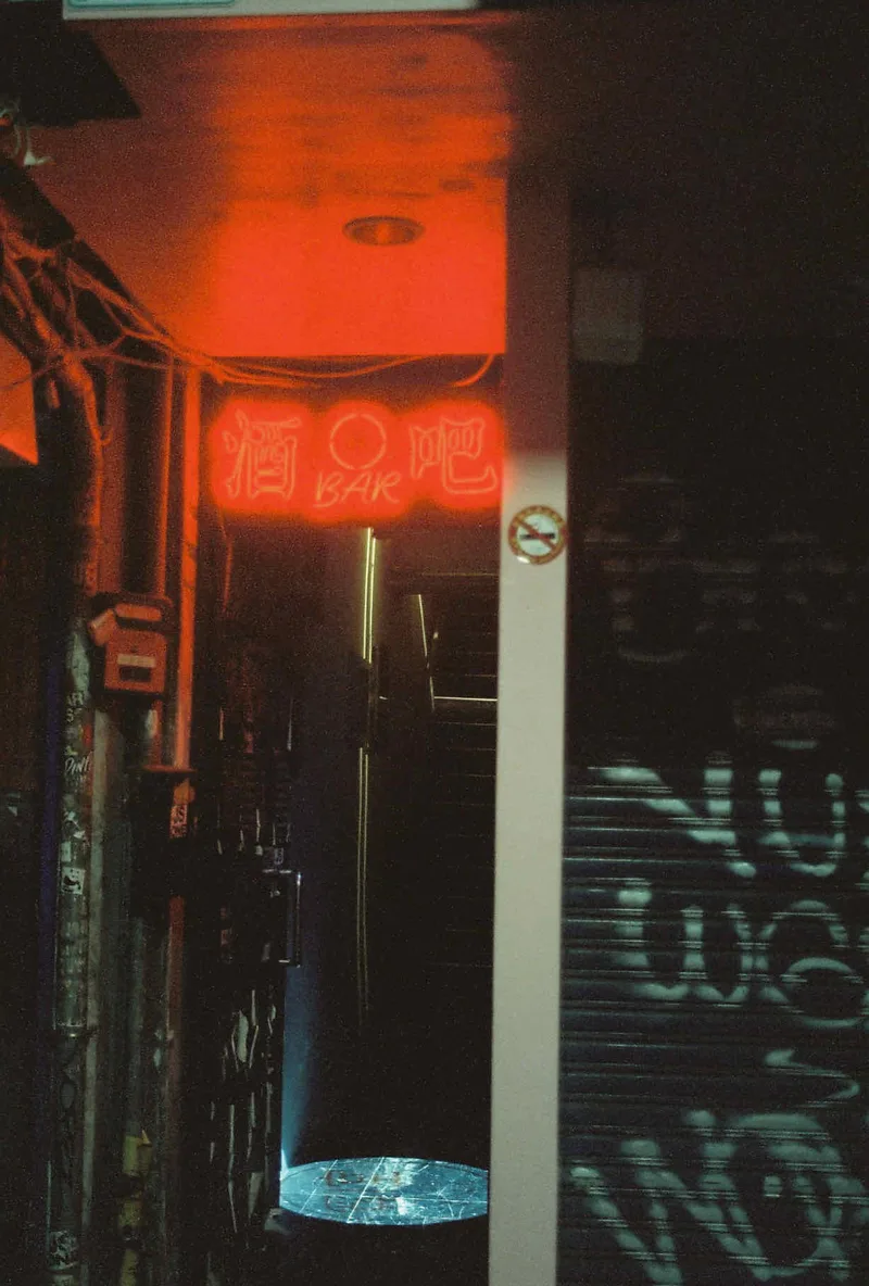 Drinking avenue shot on Cinestill 800T with a Minolta Dynax 404si, developed at Labo Germain Photo, by Ambre