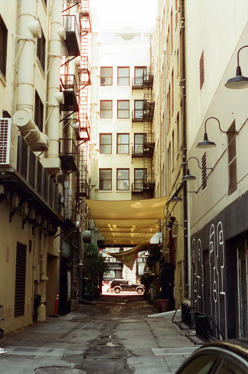 Downtown Alley shot on Cinestill 400D with a Nikon F100, developed at Valley Photo Service, by Anthony Balboa