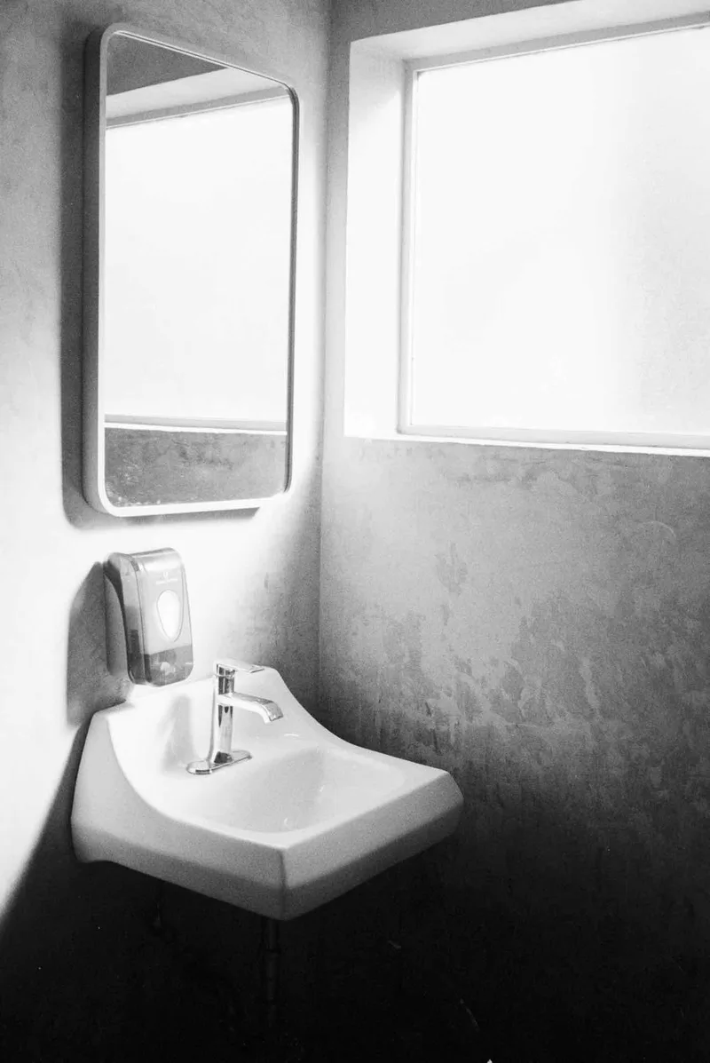 Cemetery Bathroom shot on Kodak T-Max 400 with a Zeiss IkonZM, developed at Home / Self-Developed, by Mike Ginn