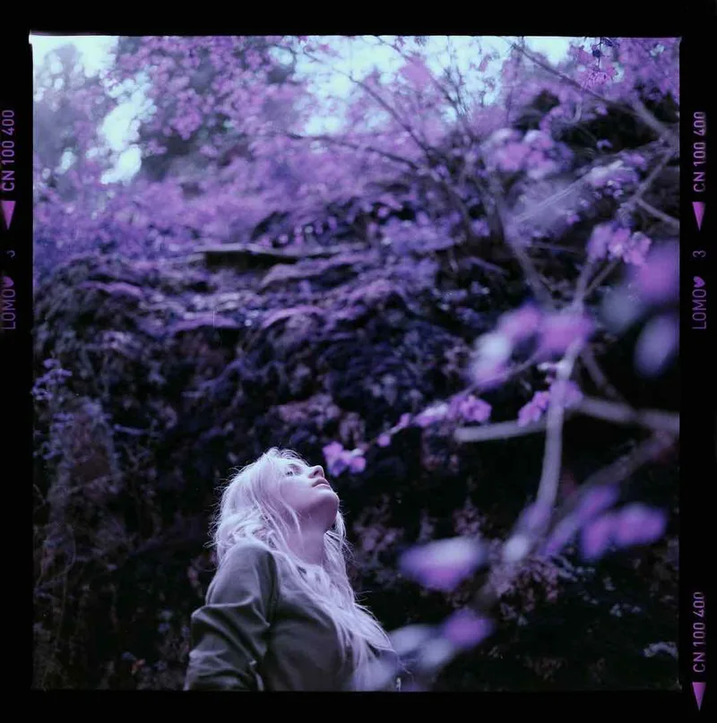 She rises shot on Lomography LomoChrome Purple 100 with a Hasselblad 500C/M, developed at Home / Self-Developed, by Robert Luxun