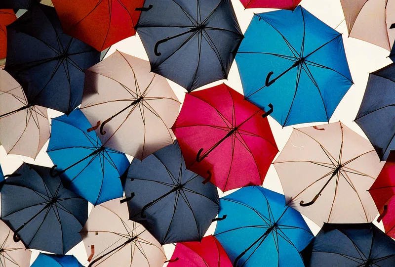 Umbrellas shot on Cinestill 800T with a Nikon F100, developed at Panajou Bordeaux, by Vincent Copié