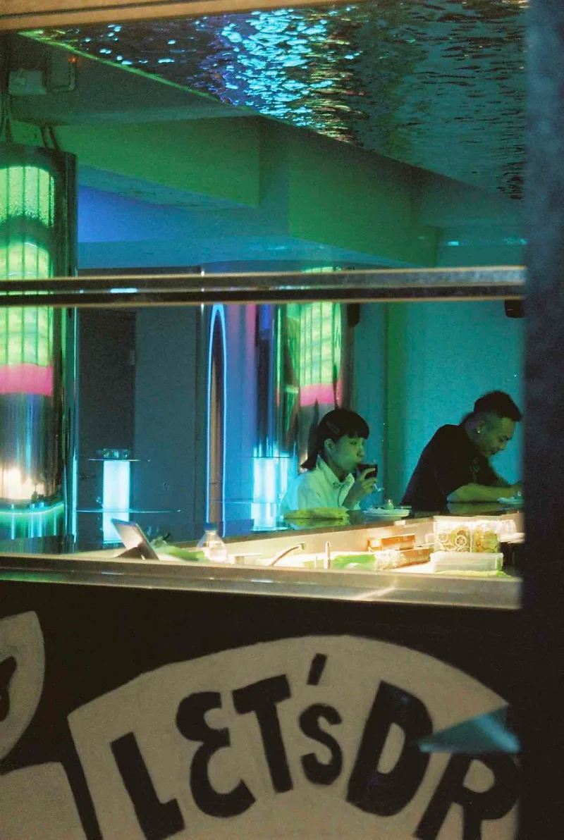Let’s Dr…. shot on Cinestill 800T with a Minolta Dynax 404si, developed at Labo Germain Photo, by Ambre