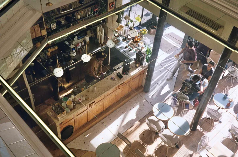 cafe reflection shot on Kodak Gold 200 with a Olympus Mju II Zoom 80, developed at Kodak Express Grands Boulevards, by Jen