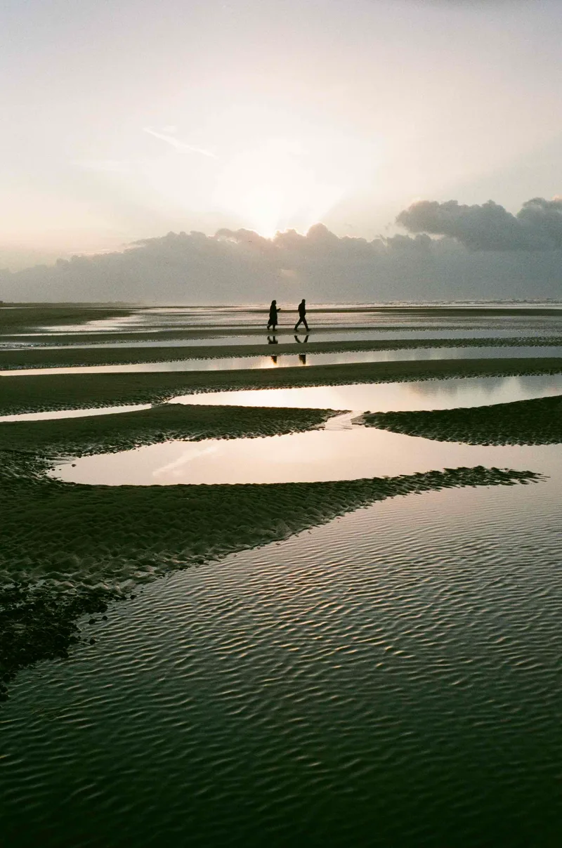 Morning walkers, Camber Sands shot on Kodak Gold 200 with a Olympus Trip 35, developed at Take It Easy, by Jon