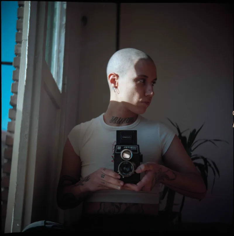 Me shot on Kodak Portra 160 with a Lubitel 166B, by Rebecabalas_