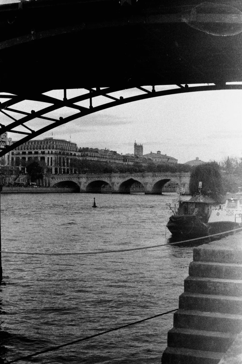 under the pont des arts in paris shot on Ilford Kentmere Pan 400 with a Pentax MV1, developed at Home / Self-Developed, by Paulina