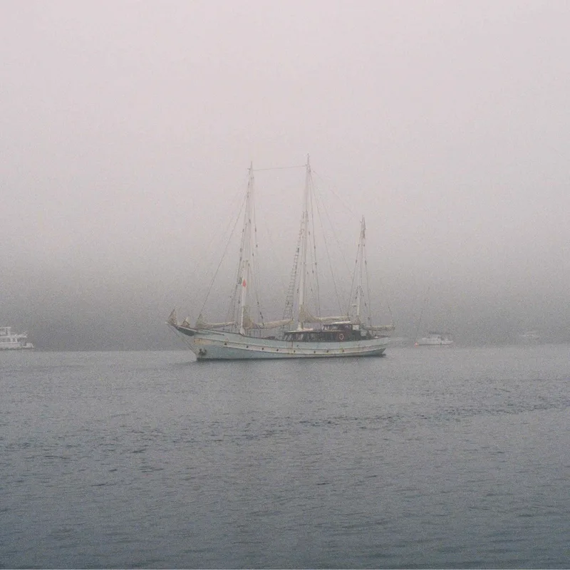 Boat on a misty day shot on Kodak Portra 400 with a Canon AE-1, developed at John Gunn Cameras, by Ahmed
