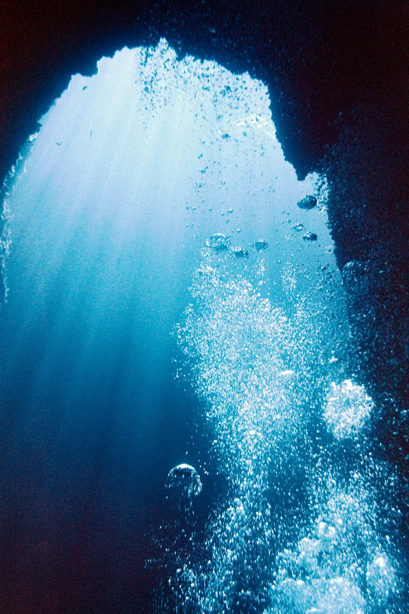 Rising bubbles in Giannutri shot on Cinestill 400D with a Nikonos V, developed at Home / Self-Developed, by Marco Manuzzi