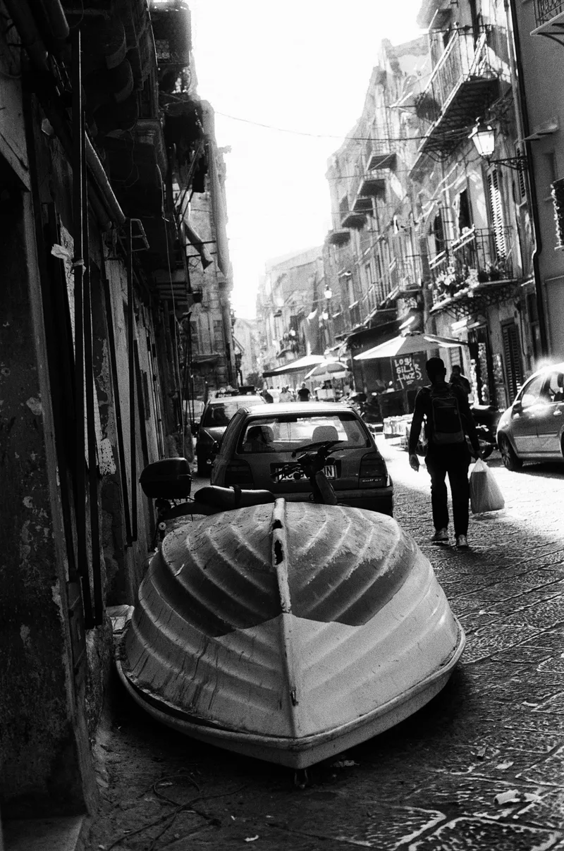 Parking spot shot on Foma Fomapan 100 Classic with a Nikon FM, developed at Il Colore, by Alessandro Specchio