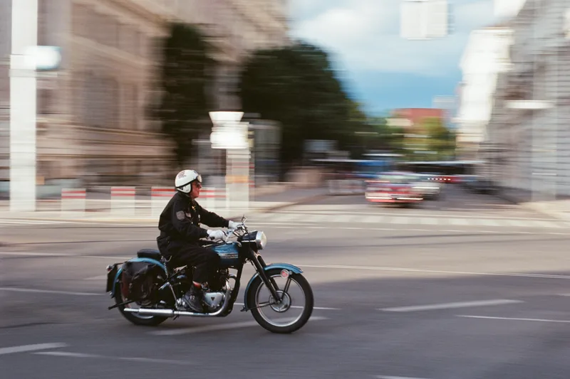 Blurry Biker shot on Kodak Ektar 100 with a Minolta XG-1, developed at Garage Film Lab, by Simon